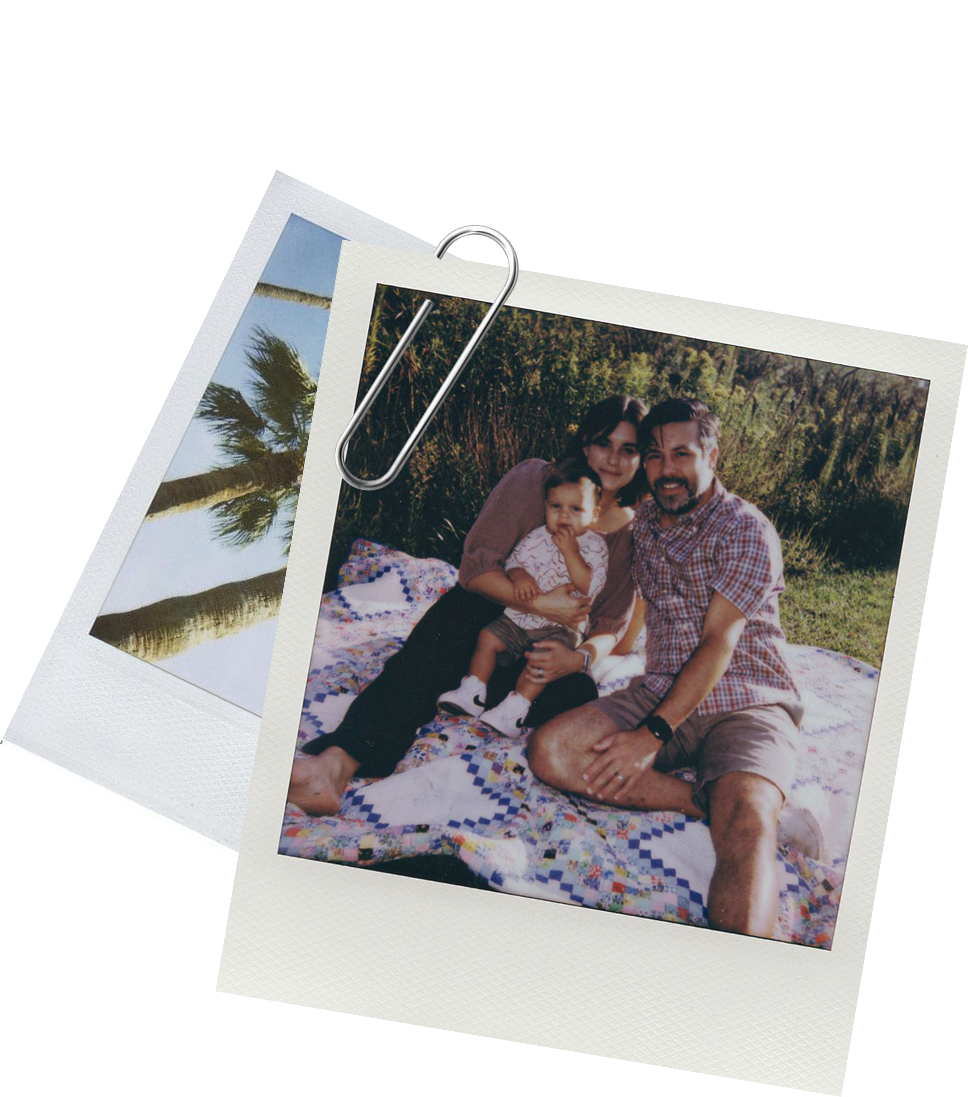 Polaroid of a couple with a baby on a picnic blanket